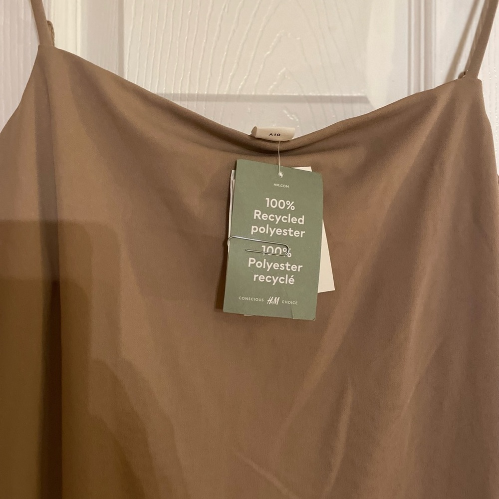 Slip dress with one sided slit.